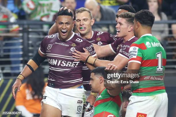 Haumole Olakau'atu of the Sea Eagles celebrates with his team mates after scoring a try during the round one NRL match between Manly Sea Eagles and...