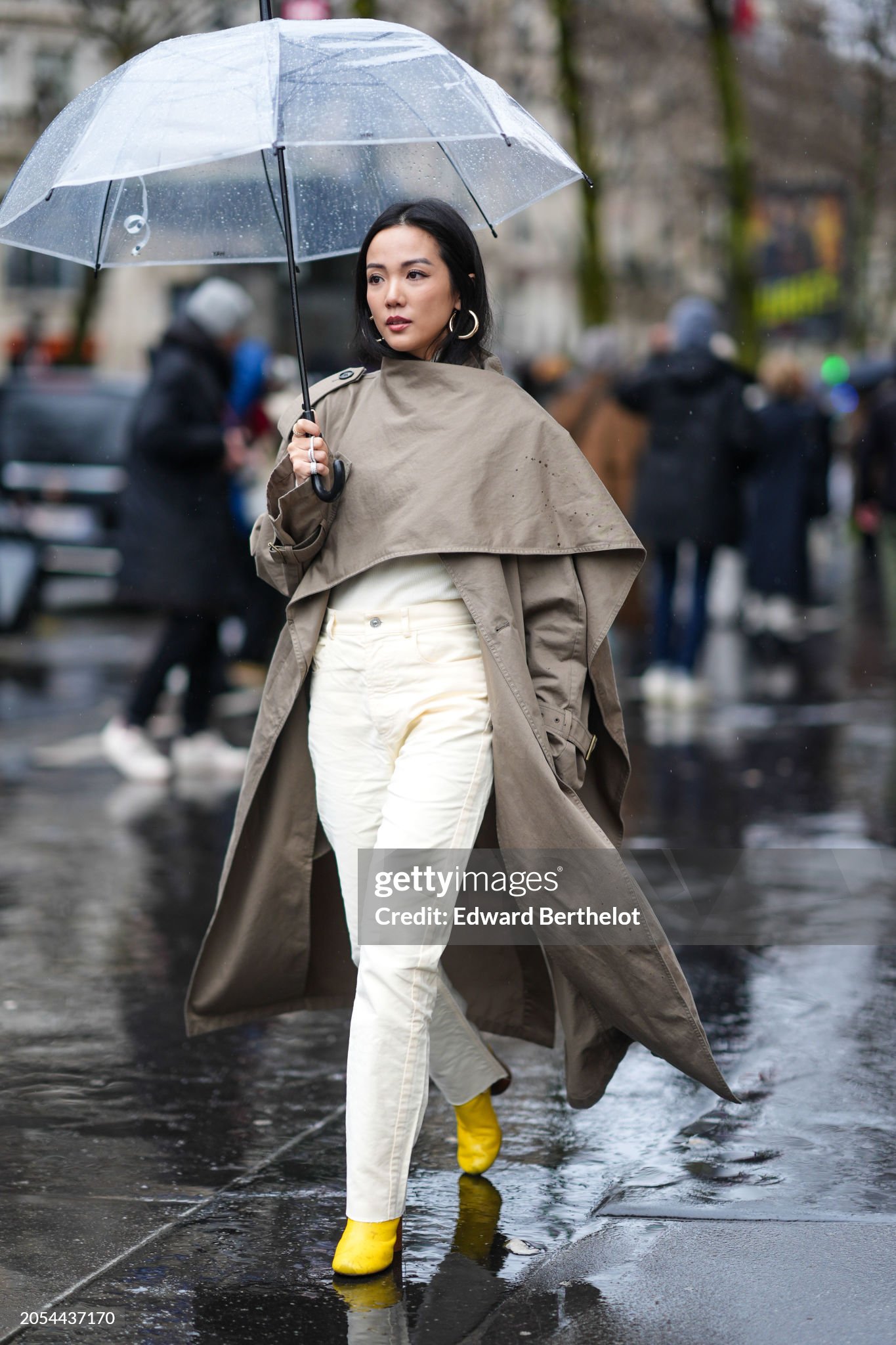 paris-france-yoyo-cao-wears-a-gray-trench-long-coat-beige-pants-yellow-pointed-shoes-outside.jpg