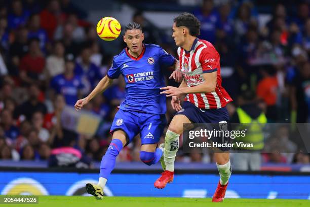 Uriel Antuna of Cruz Azul battles for possession with Jesus Orozco of Chivas during the 10th round match between Cruz Azul and Chivas as part of the...