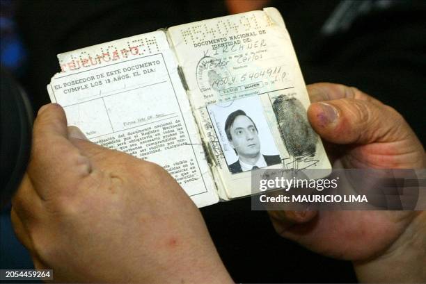 The identity papers of Argentinian presidential candidate Nestor Kirchner as he goes to vote in Rio Gallegos 27 April 2003. AFP PHOTO/Mauricio LIMA...