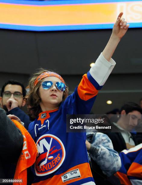 Fan celebrates the Islanders victory over the Bruins at UBS Arena on March 02, 2024 in Elmont, New York. The Islanders defeated the Bruins 5-1.