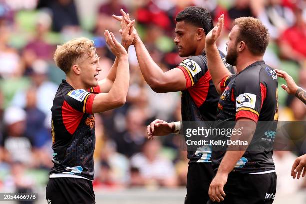Damian McKenzie of the Chiefs celebrates scoring a try during the round two Super Rugby Pacific match between Chiefs and ACT Brumbies at AAMI Park,...