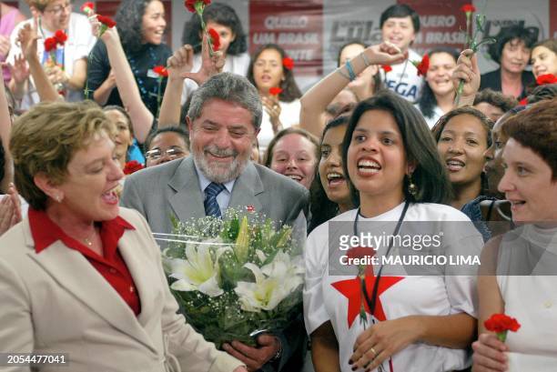 Luiz Inacio Lula da Silva , Brazilian presidential candidate for the leftist Workers Party, smiles at his wife Marisa 04 October 2002 during a...