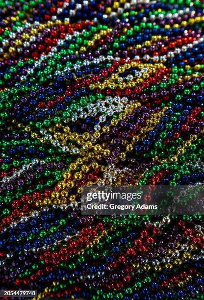 mardi gras beads - mardi gras party stock pictures, royalty-free photos & images