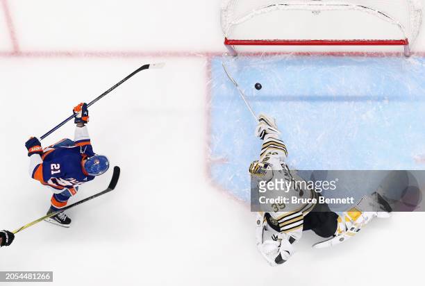 Kyle Palmieri of the New York Islanders scores one of the his first period goals against Linus Ullmark of the Boston Bruins at UBS Arena on March 02,...