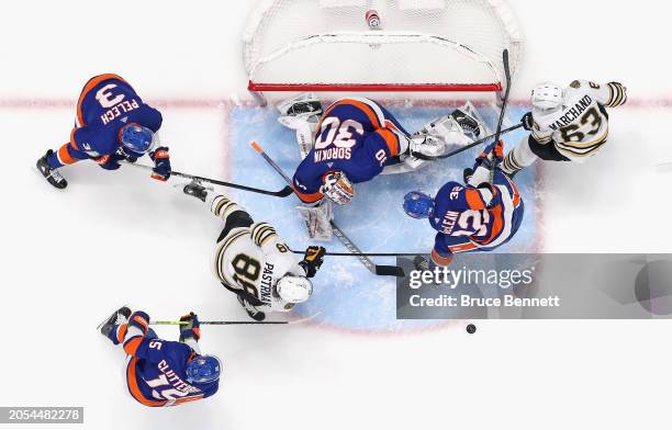 Ilya Sorokin of the New York Islanders defends the net against David Pastrnak of the Boston Bruins at UBS Arena on March 02, 2024 in Elmont, New...