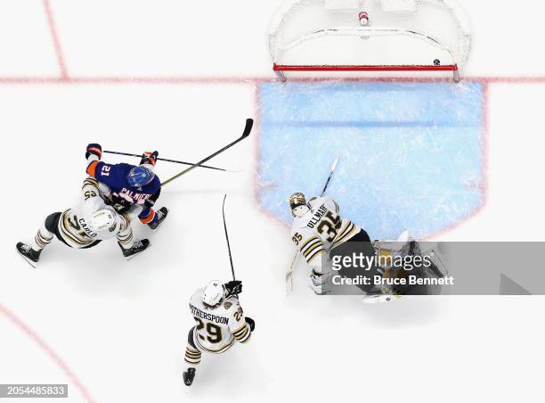 Kyle Palmieri of the New York Islanders scores one of the his first period goals against Linus Ullmark of the Boston Bruins at UBS Arena on March 02,...
