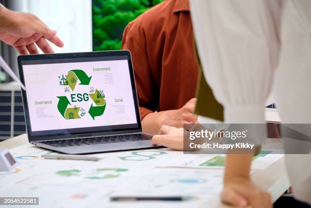 group of business esg meeting environment, society and governance, discussing renewable energy wind turbine solar panel, eco- friendly net zero emission business ethical, reduce carbon footprint pollution greenhouse gas reuse recycle for sustainable - environmental social corporate governance esg stock pictures, royalty-free photos & images