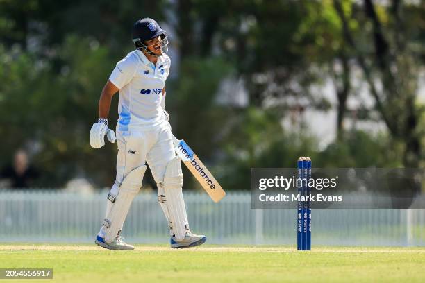 Ollie Davies of New South Wales reacts after a hit by the ball to his arm during the Sheffield Shield match between New South Wales and South...