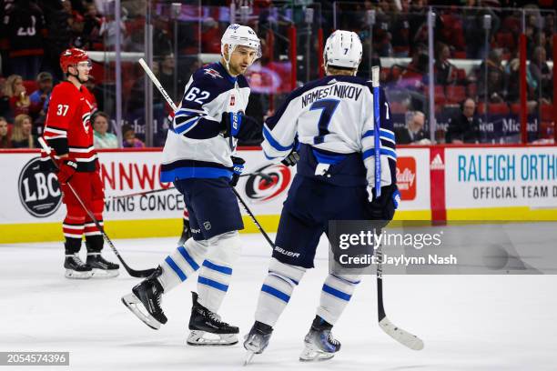 Nino Niederreiter of the Winnipeg Jets and Vladislav Namestnikov celebrates a goal during the third period of the game against the Carolina...