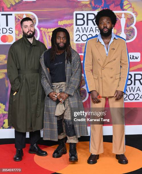 Graham ‘G’ Hastings, Kayus Bankole and Alloysious Massaquoi of Young Fathers attend the BRIT Awards 2024 at The O2 Arena on March 02, 2024 in London,...