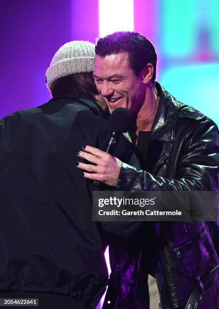 Luke Evans presents Bring Me The Horizon with the Best Alternative / Rock award on stage during the BRIT Awards 2024 at The O2 Arena on March 02,...