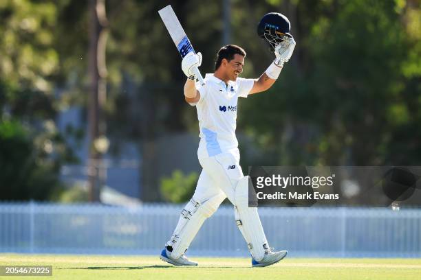 Ollie Davies of New South Wales celebrates after reaching a century during the Sheffield Shield match between New South Wales and South Australia at...