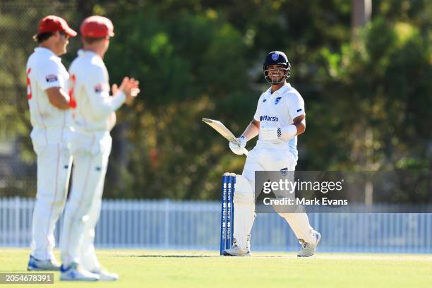 Ollie Davies of New South Wales runs between wickets to reach a century during the Sheffield Shield match between New South Wales and South Australia...