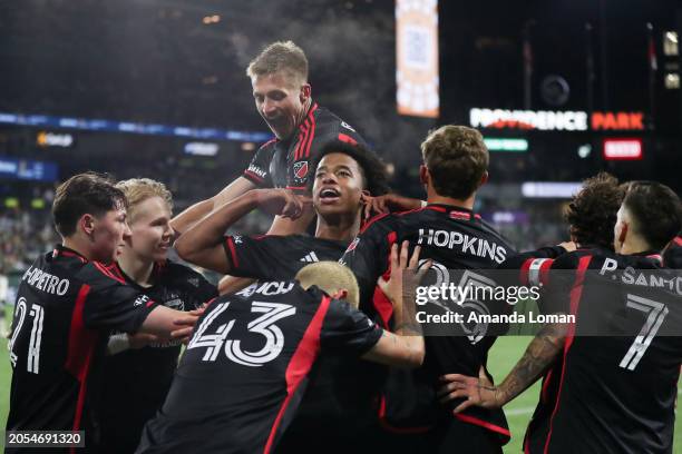 Kristian Fletcher of D.C. United, center, celebrates after scoring a goal against the Portland Timbers with teammates during the second half at...