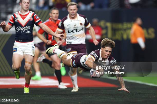 Reece Walsh of the Broncos dives over to score a try during the round one NRL match between Sydney Roosters and Brisbane Broncos at Allegiant...