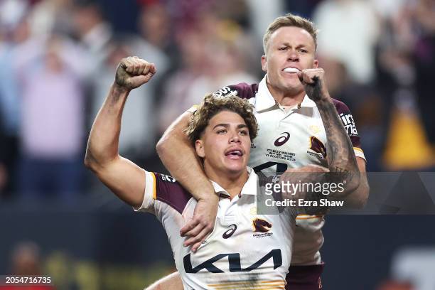 Billy Walters and Reece Walsh of the Broncos celebrate Walsh scoring a try during the round one NRL match between Sydney Roosters and Brisbane...