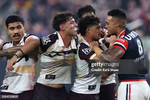 Spencer Leniu of the Roosters exchanges heated words with Kotoni Staggs of the Broncos during the round one NRL match between Sydney Roosters and...