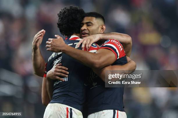 Joseph-Aukuso Suaalii and Daniel Tupou of the Roosters celebrate victory during the round one NRL match between Sydney Roosters and Brisbane Broncos...