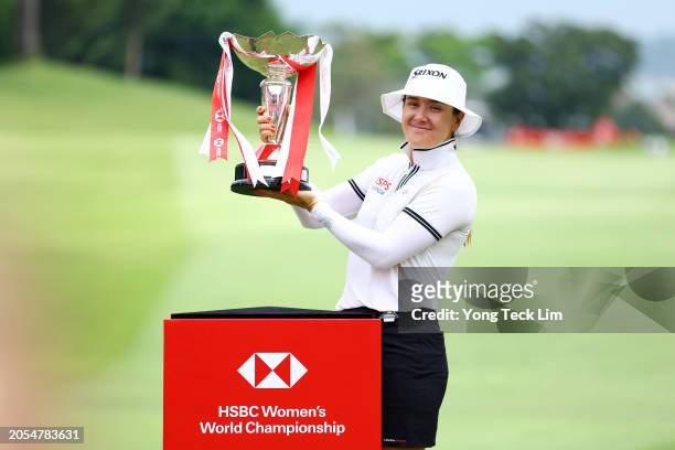 Hannah Green of Australia celebrates with the trophy after winning the HSBC Women's World Championship at Sentosa Golf Club on March 03, 2024 in...