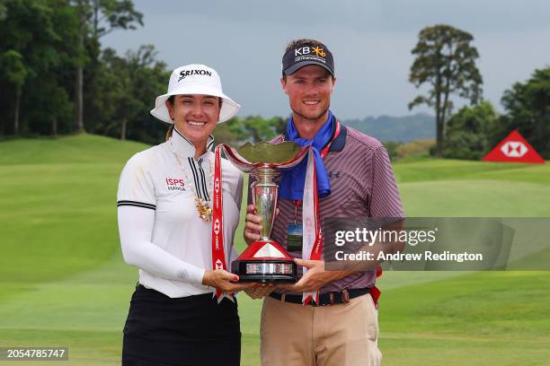 Hannah Green of Australia poses with her caddie and the trophy on the 18th green following victory on Day Four of the HSBC Women's World Championship...