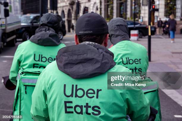 Uber Eats takeaway delivery cycle couriers on 5th March 2024 in London, United Kingdom. Uber Eats is an online food ordering and delivery platform...