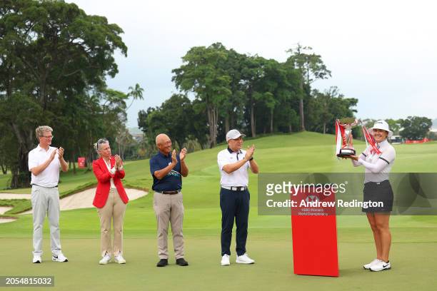 Hannah Green of Australia lifts the trophy in celebration of victory on the 18th green on Day Four of the HSBC Women's World Championship at Sentosa...