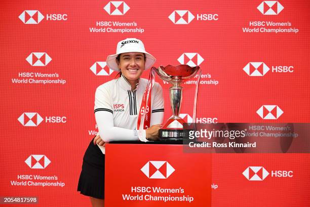 Hannah Green of Australia poses with the trophy in the HSBC Hexagon Suite following victory on Day Four of the HSBC Women's World Championship at...