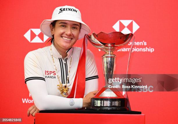 Hannah Green of Australia poses with the trophy in the HSBC Hexagon Suite following victory on Day Four of the HSBC Women's World Championship at...