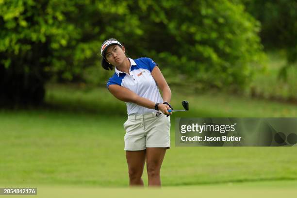 Bianca Pagdanganan of the Philippines pitches onto the green on hole 13 during Day Four of the HSBC Women's World Championship at Sentosa Golf Club...