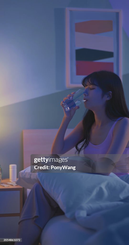 Asain woman take sleeping pills