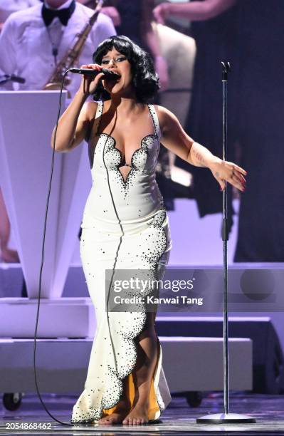Raye performs on stage during the BRIT Awards 2024 at The O2 Arena on March 02, 2024 in London, England.