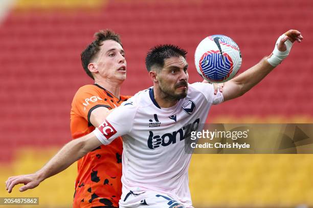 Kai Trewin of the Roar and Bruno Fornaroli Victory compete for the ball during the A-League Men round 19 match between Brisbane Roar and Melbourne...