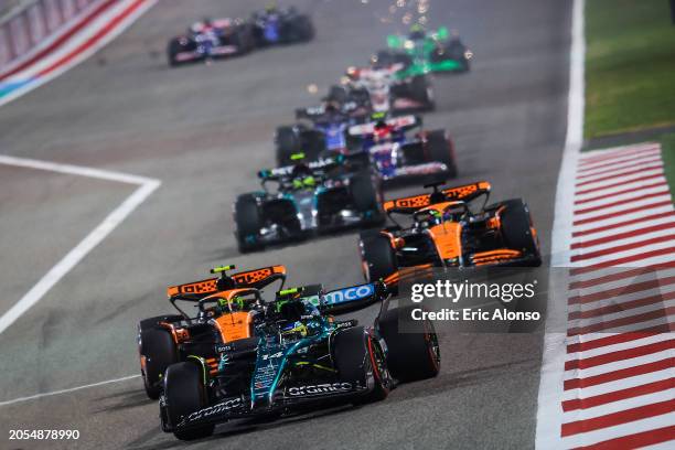 Fernando Alonso of Spain driving the Aston Martin AMR24 Mercedes on track leads the group during the F1 Grand Prix of Bahrain at Bahrain...