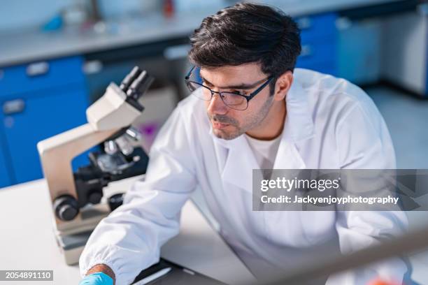 man working in laboratory - pathologist stock pictures, royalty-free photos & images