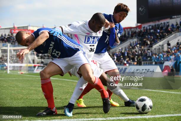 Victor Ibarbo of Sagan Tosu competes for the ball against David Babunski and Jun Amano of Yokohama F.Marinos during the J.League J1 match between...