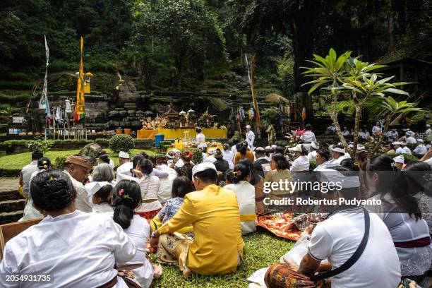 Indonesian Hindu devotees pray during the Melasti ritual at Jolotundo Temple on March 03, 2024 in Mojokerto, Indonesia. The Melasti ritual is held...