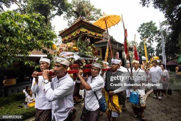 Indonesian Hindu devotees parade bring offerings during the Melasti ritual at Jolotundo Temple on March 03, 2024 in Mojokerto, Indonesia. The Melasti...