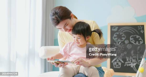 asian mother accompany child study - accompanying stock pictures, royalty-free photos & images