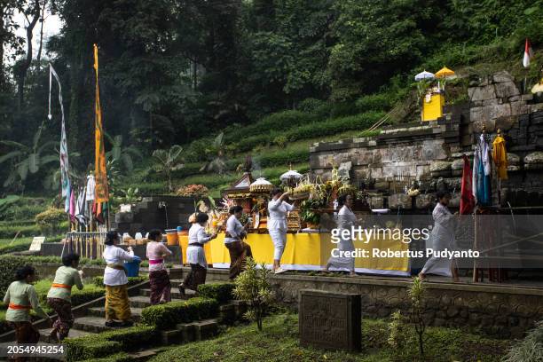 Indonesian Hindu devotees parade bring offerings during the Melasti ritual at Jolotundo Temple on March 03, 2024 in Mojokerto, Indonesia. The Melasti...