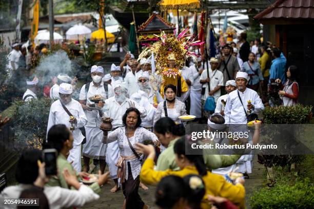 Indonesian Hindu devotees parade bring offerings during the Melasti ritual at Jolotundo Temple on March 03, 2024 in Mojokerto, Indonesia. The Melasti...