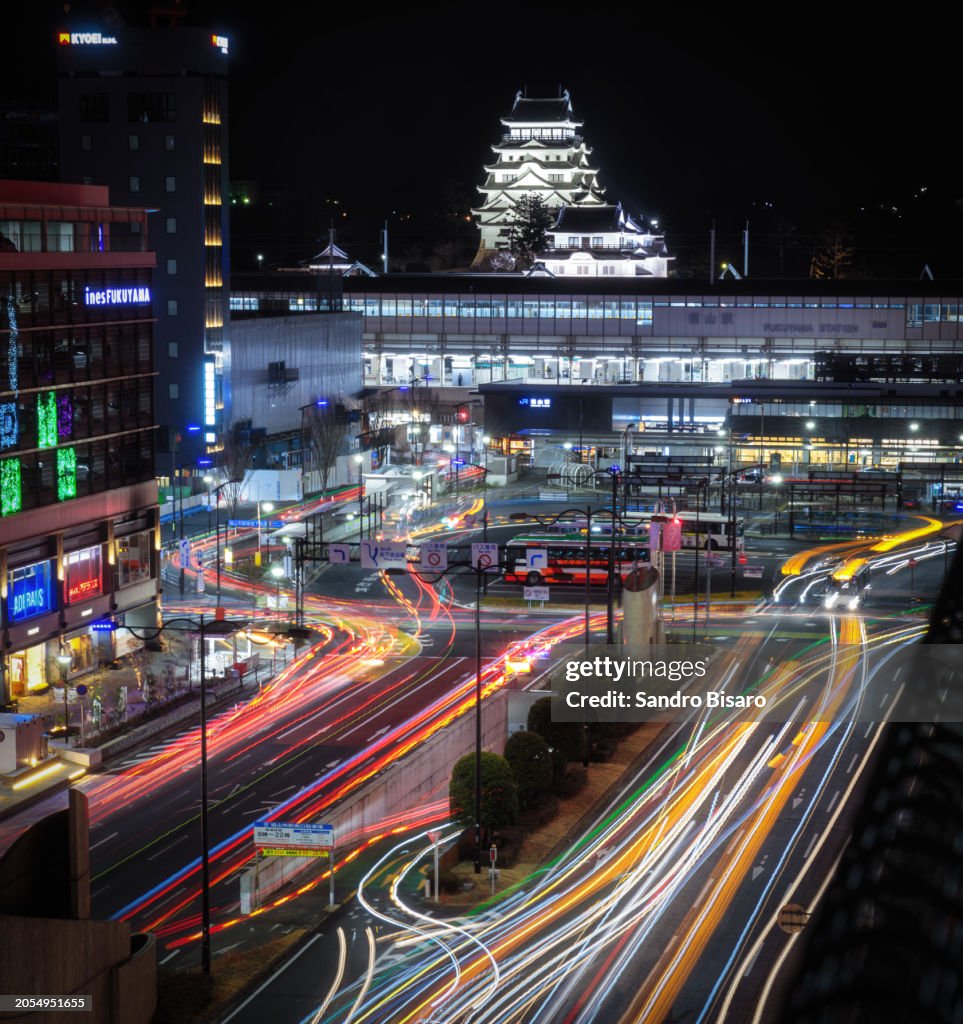 Fukuyama Castle in Fukuyama at night with car light trails