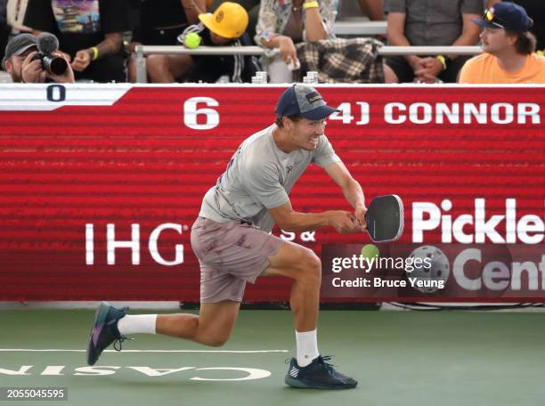 Connor Garnett hits a backhand drive shot cross court for a winner against Ben Johns in the 2024 PPA Carvana Mesa Arizona Cup semi-finals match of...