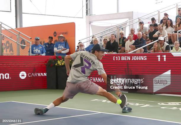 Connor Garnett runs back to the baseline to hit a difficult backhand return against Ben Johns in the 2024 PPA Carvana Mesa Arizona Cup semi-finals...