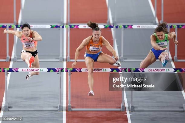 Masumi Aoki of Team Japan, Nadine Visser of Team Netherlands and Nika Glojnaric of Team Slovenia compete in Heat 1 of the Women's 60 Metres Hurdles...