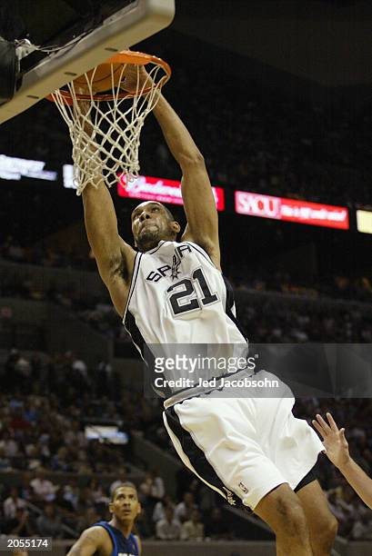 Tim Duncan of the San Antonio Spurs slam dunks in Game five of the Western Conference Finals during the 2003 NBA Playoffs against the Dallas...