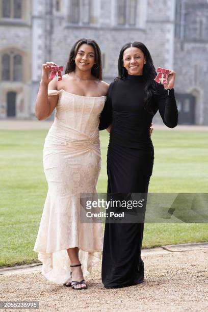 British gymnasts Elissa Downie and Rebecca Downie pose after being made Members of the Order of the British Empire during an investiture ceremony at...