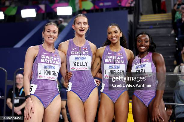 Jessie Knight, Hannah Kelly, Lina Nielsen and Ama Pipi of Team Great Britain pose for a photo after winning in Heat 2 of the Women's 4x400 Metres...
