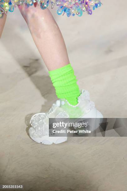 Model, shoe detail, walks the runway during the Noir Kei Ninomiya Womenswear Fall/Winter 2024-2025 show as part of Paris Fashion Week on March 02,...