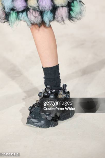 Model, shoe detail, walks the runway during the Noir Kei Ninomiya Womenswear Fall/Winter 2024-2025 show as part of Paris Fashion Week on March 02,...